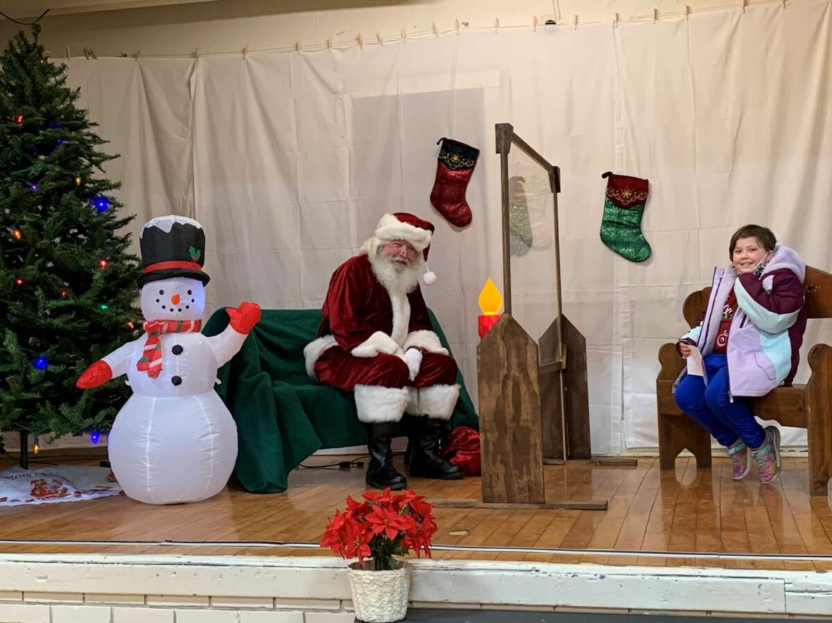 Children waited in line at the Morley Community Center on Friday for a chance to get a picture with Santa and let him know what was on their Christmas wish list. Each visitor received a goodie bag following their visit with Santa.