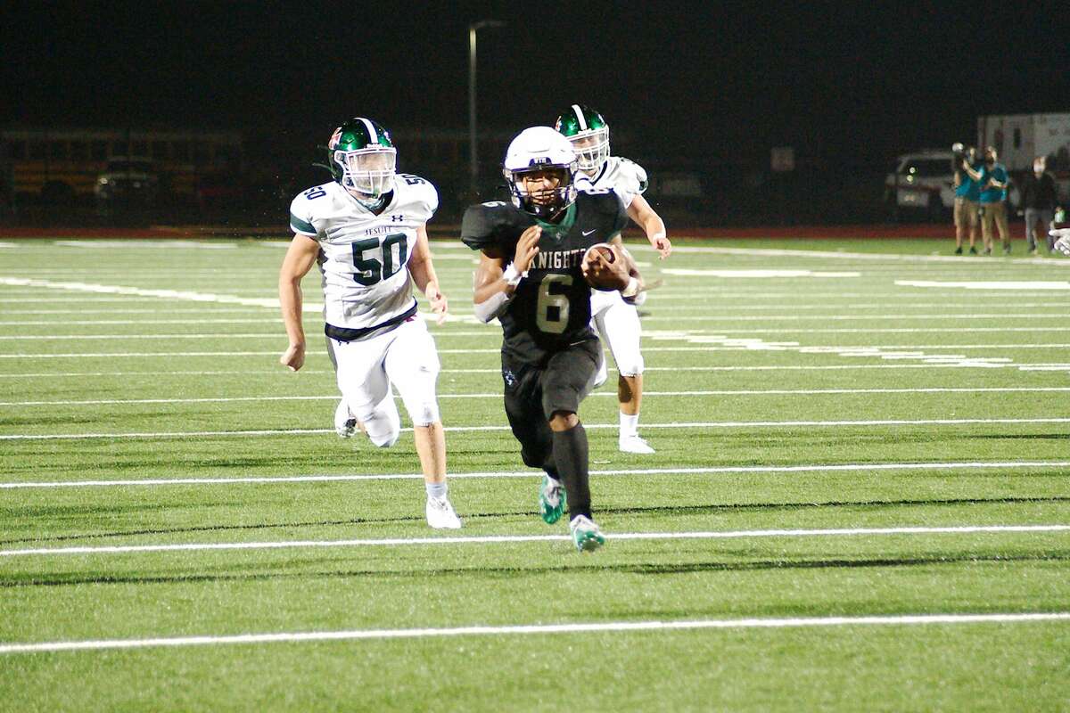 Clear Falls' David Smith (6) finds a clear path into the end zone to secure the win over Strake Jesuit Friday, Dec. 11 at Challenger Columbia Stadium.