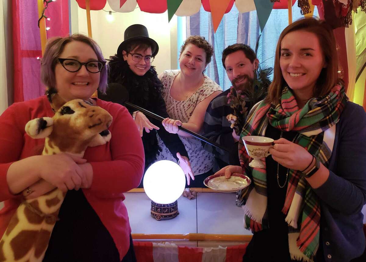 Kristina Lareau, far left, head of children's services at the Ridgefield Library, dress up with a team of librarians to promote