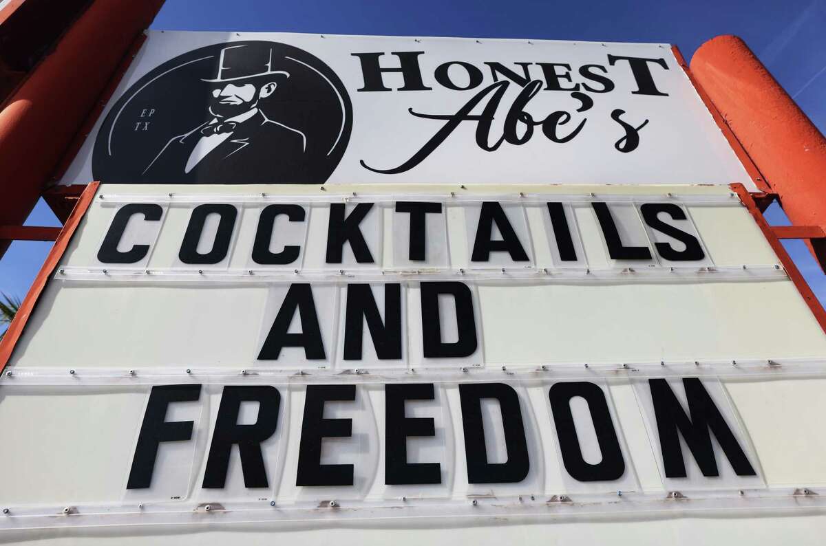 EL PASO, TEXAS - NOVEMBER 22: An indoor bar which is open displays a sign reading 'Cocktails and Freedom' amid a COVID-19 surge in the city on November 22, 2020 in El Paso, Texas. Texas surpassed 20,000 confirmed coronavirus deaths November 16, the second highest in the U.S., with active cases in El Paso now over 35,000 and confirmed COVID-19 deaths at 855. In spite of the recent spike in cases and deaths, Texas Gov. Greg Abbott recently stated to Dallas radio host Mark Davis ’We are not going to have any more lockdowns in the state of Texas’. A recent analysis by the Washington Post of cell phone data reports that states which reopened their bars had a doubling of cases of COVID-19 just three weeks later. (Photo by Mario Tama/Getty Images)