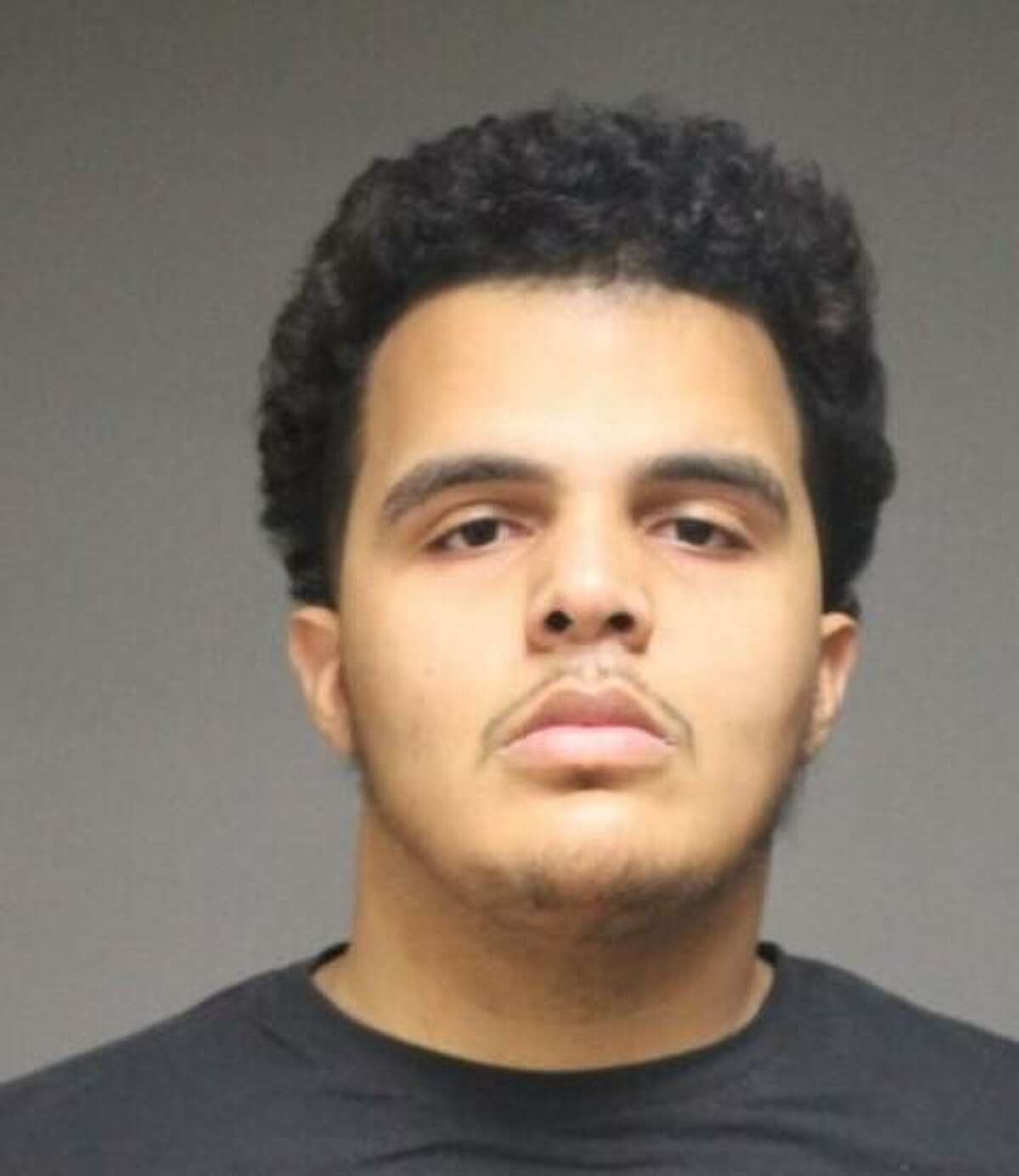 Igor Injomar Corporan, 24, was arrested and charged with first-degree larceny, conspiracy to commit larceny third-degree larceny and four counts of third-degree forgery.