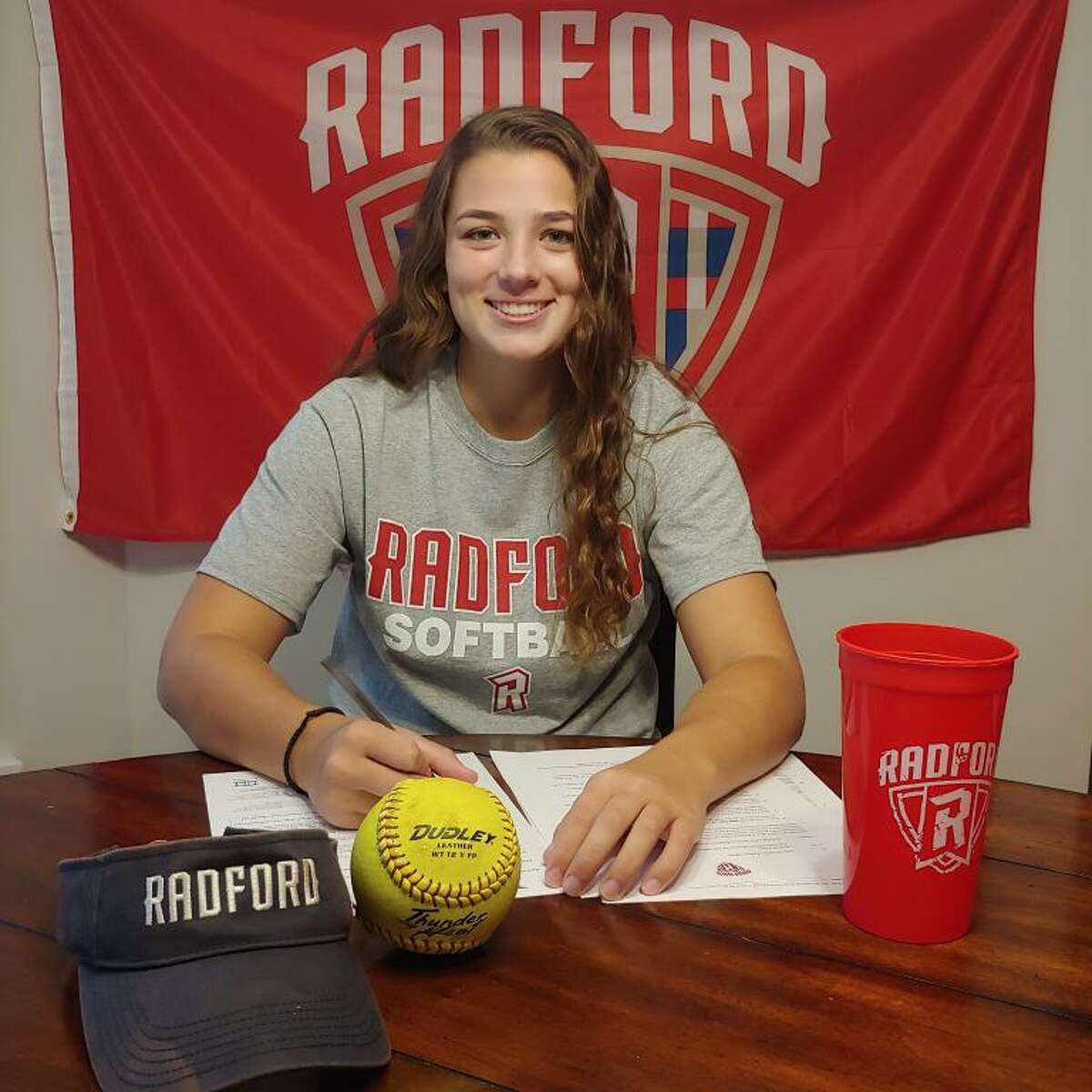 Trumbull's Cassi Barbato signs her National Letter of Intent to play Division I softball at Radford (Va.) University.