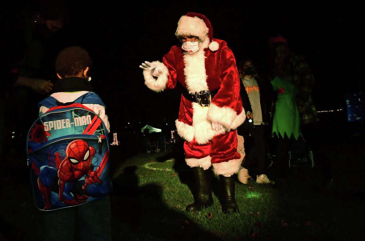 Celebrate Shelton holds its seventh annual community tree lighting Friday, December 11, 2020, at the Rotary Pavilion at Veteran’s Memorial Park in Shelton, Conn. In addition to the tree lighting and the visit from Santa and Mrs. Claus, the event featured an ice sculpture demonstration by Ice Matters; a fire dance performance with Sarotonin Performance Arts; and a holiday dance party. The community tree lighting was sponsored by the city, Center Stage Theatre, Apple Rehab, Jones Family Farm, Echo Hose Hook & Ladder Co. 1 and Valley Community Foundation.
