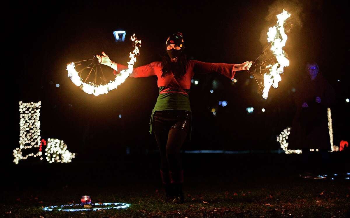 Celebrate Shelton holds its seventh annual community tree lighting Friday, December 11, 2020, at the Rotary Pavilion at Veteran's Memorial Park in Shelton, Conn. In addition to the tree lighting and the visit from Santa and Mrs. Claus, the event featured an ice sculpture demonstration by Ice Matters; a fire dance performance with Sarotonin Performance Arts; and a holiday dance party. The community tree lighting was sponsored by the city, Center Stage Theatre, Apple Rehab, Jones Family Farm, Echo Hose Hook & Ladder Co. 1 and Valley Community Foundation.