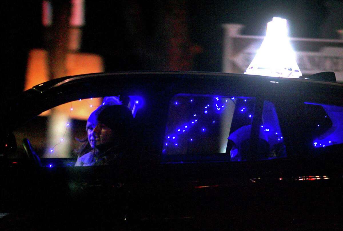Members of Chabad of Fairfield hold a Car Menorah Parade along Post Road in Fairfield, Conn., on Thursday Dec. 10, 2020. A Menorah lighting to celebrate Hanukkah came at the end of the parade that started at Chabad of Fairfield, joined Chabad of Shelton and Chabad of Westport members midway along the route along Post Road in Fairfield.