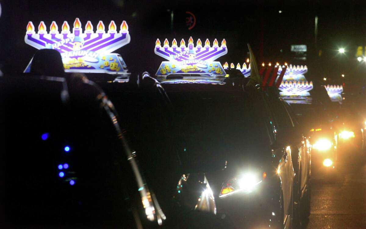 Members of Chabad of Fairfield hold a Car Menorah Parade along Post Road in Fairfield, Conn., on Thursday Dec. 10, 2020. A Menorah lighting to celebrate Hanukkah came at the end of the parade that started at Chabad of Fairfield, joined Chabad of Shelton and Chabad of Westport members midway along the route along Post Road in Fairfield.