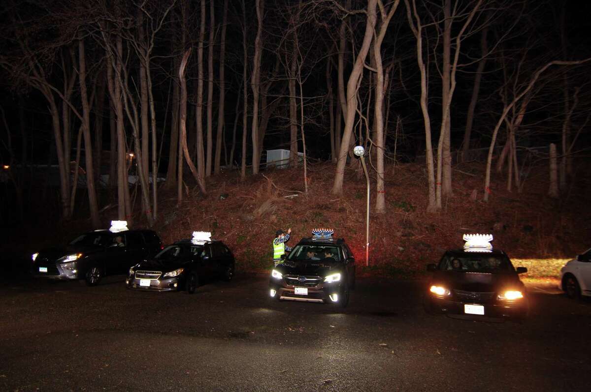 Members of Chabad of Fairfield hold a Car Menorah Parade along Post Road in Fairfield, Conn., on Thursday Dec. 10, 2020. A Menorah lighting to celebrate Hanukkah came at the end of the parade that started at Chabad of Fairfield, joined Chabad of Shelton and Chabad of Westport members midway along the route along Post Road in Fairfield.