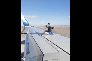 Man arrested after wing-walking stunt at Las Vegas airport