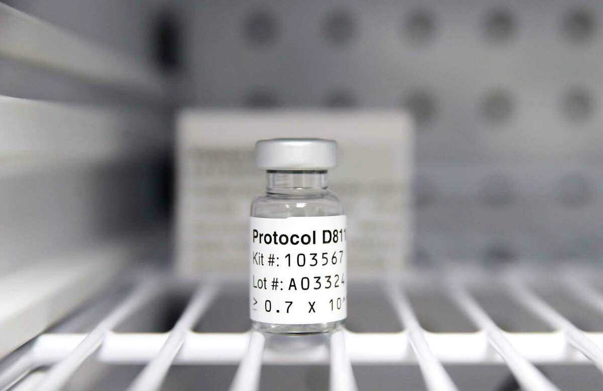 A sterile vial of AstraZeneca Phase III trial COVID vaccine sits in a refrigerator at the Prism Health North Texas location in Oak Cliff, Thursday, December 3, 2020. The clinic administers the vaccine to non-COVID patients participating in the trial study. (Tom Fox/The Dallas Morning News/TNS)