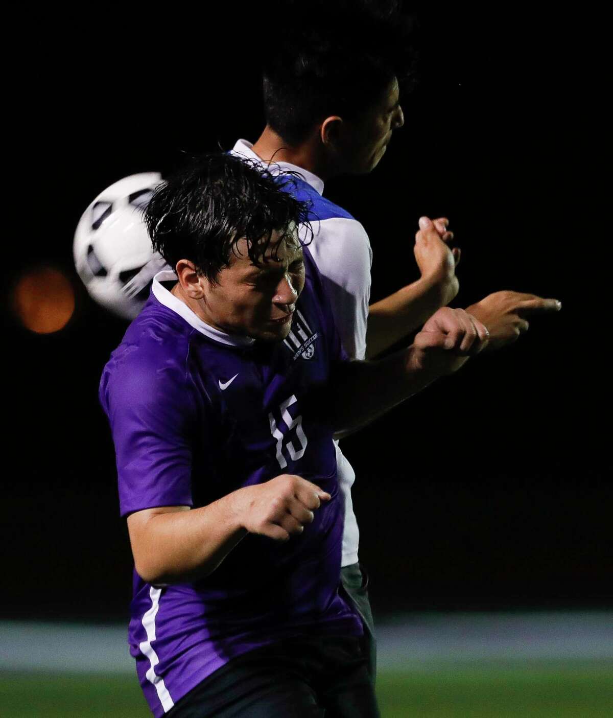 Willis’ Oscar Flores (15) and New Caney’s Alessandro Trevino (2) go for a header during the first period of a District 20-5A high school soccer match at Berton A. Yates Stadium, Tuesday, Jan. 14, 2020, in Willis.