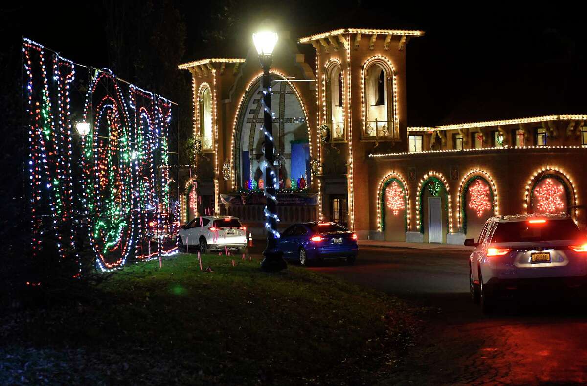 Cars are seen driving slowly past displays at the Capital Holiday Lights in Washington Park on Thursday, Dec. 10, 2020 in Albany, N.Y. (Lori Van Buren/Times Union)
