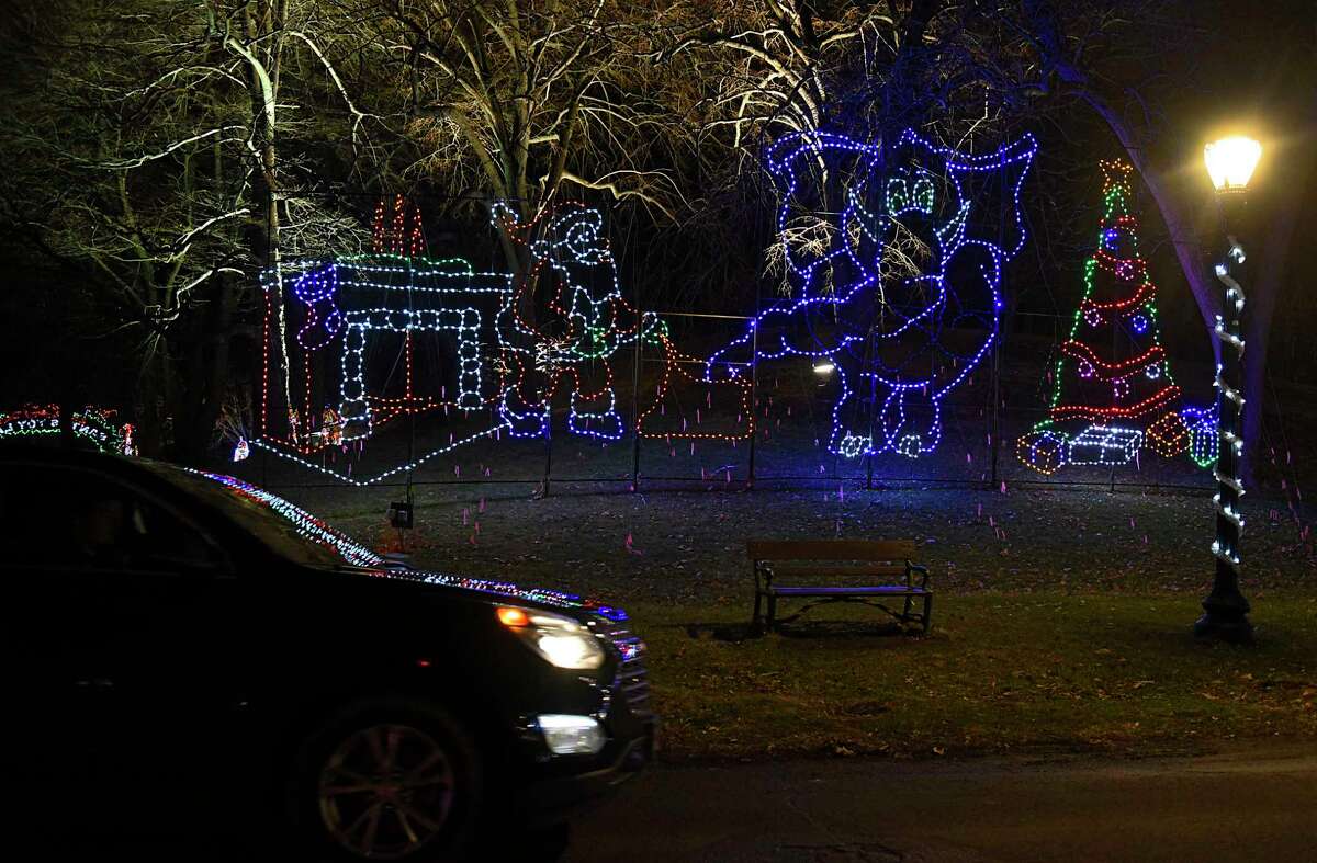 Cars are seen driving slowly past displays at the Capital Holiday Lights in Washington Park on Thursday, Dec. 10, 2020 in Albany, N.Y. (Lori Van Buren/Times Union)