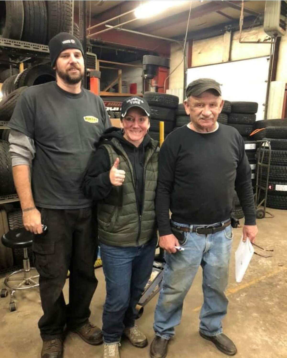 Gary Murphy, right, founder of Murphy's Tire Shop in New Milford, is shown with his daughter Beth and her husband, Jeff Taylor, the new owners of the business located at 11 Howland Road.
