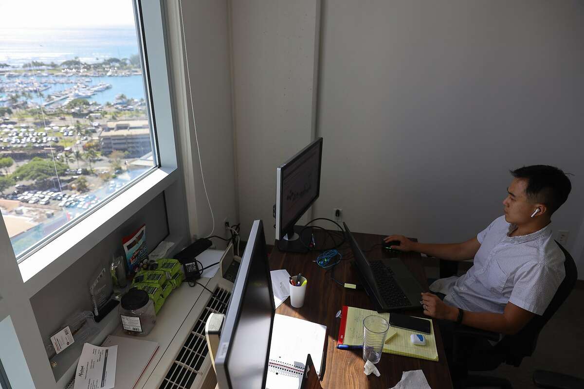 Richard Matsui, CEO of solar company kWh Analytics, works from his home office at a condo in Kaka‘ako, Hawaii, one of many workers who’ve left the Bay Area for Hawaii in the pandemic.