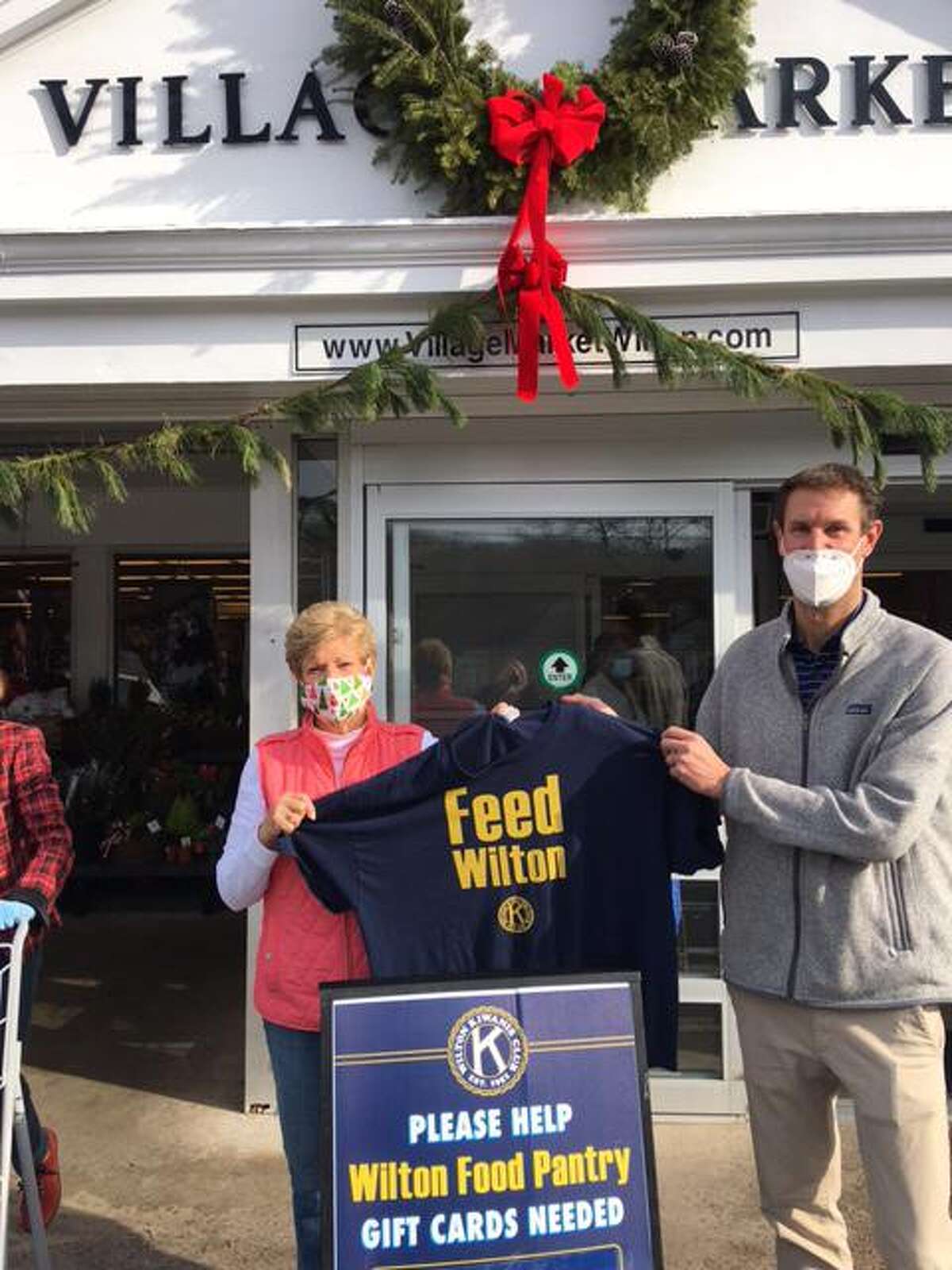 Kiwanis Vice President Carol Boehly and Village Market co-owner Tim Dolnier stand outside the market on Dec. 13, following a successful fundraiser for Wilton's food pantry.