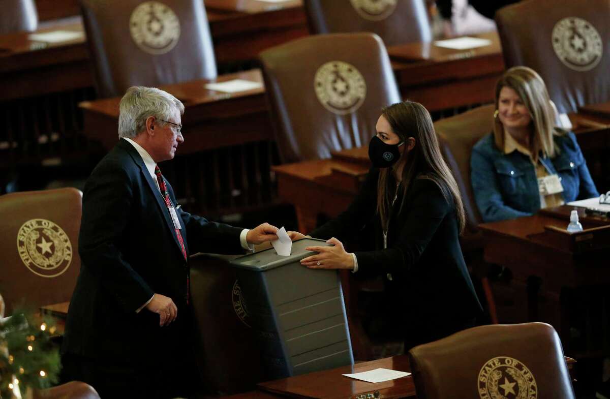 Matt Patrick (CD32) casts a presidential ballot for President Donald Trump during the meeting of the presidential electors in the House Chamber of the Texas State Capital on Monday, December 14, 2020 in Austin. All 38 electors voted for Trump and Vice President Mike Pence. (Vernon Bryant/The Dallas Morning News)