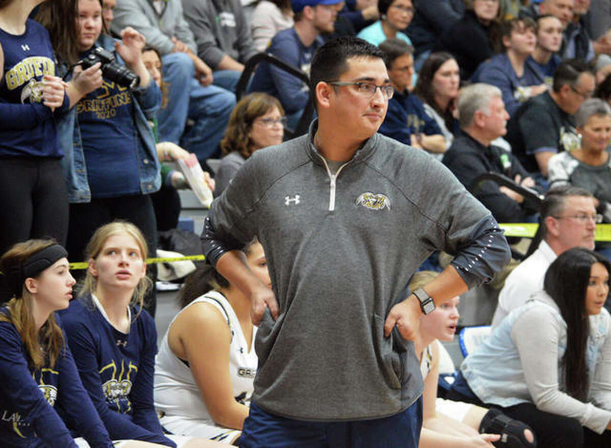 Father McGivney athletic director and girls basketball coach Jeff Oller paces the sideline during a game last season.