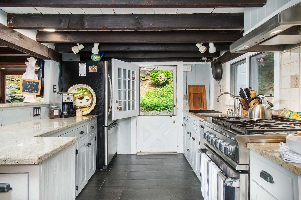 Updated chefâs kitchen at 28 Valley Road, Westport. This updated antique structure was originally an onion barn converted into a sophisticated residence with up-to-date amenities. It was built circa 1879, according to the Westport Historical Resources Inventory list, and a sign attached to the front façade identifies it as