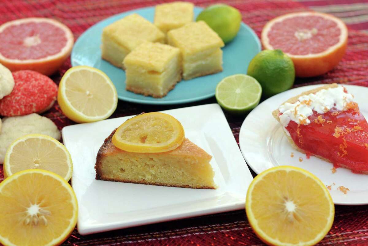 We’re celebrating Texas’ citrus season in four desserts. Clockwise from bottom: Orange Syrup Cake with Candied Oranges, Lemon Sugar Cookies, Leftover Citrus Bars and Rio Star Grapefruit Pie.