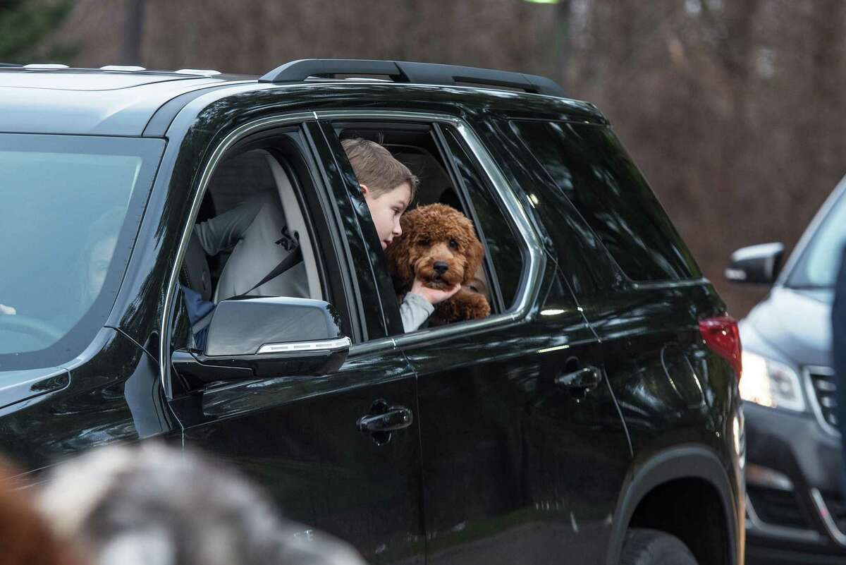 John Ely and his dog, Blake, check out the animals at the drive-by living nativity.