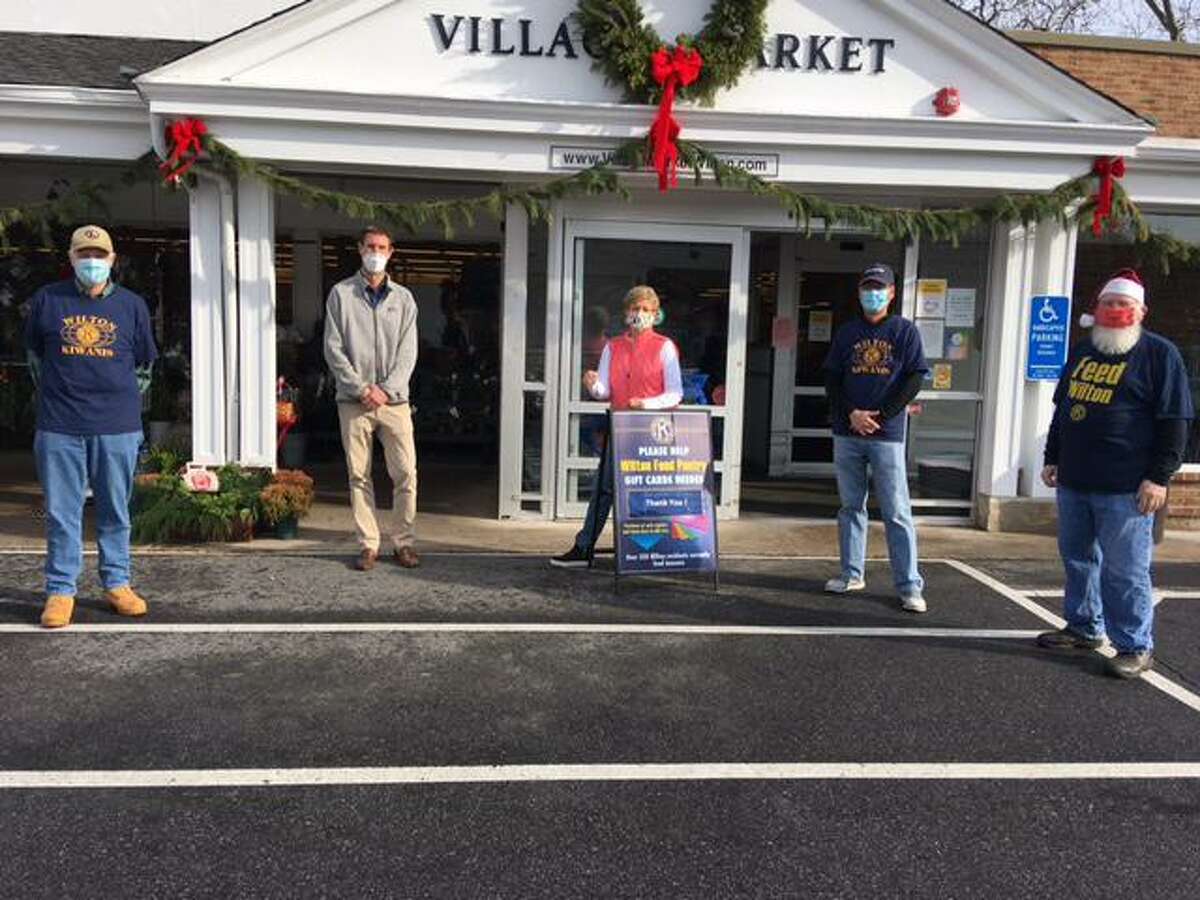At the Kiwanis food drive from Dec. 11-13, are, from left, Den Taylor (Kiwanis President-Elect), Tim Dolnier (co-owner and President of Village Market), Carol Boehly (Kiwanis Vice President), Greg Chann (Kiwanis President), Jack McFadden (Kiwanis PR).