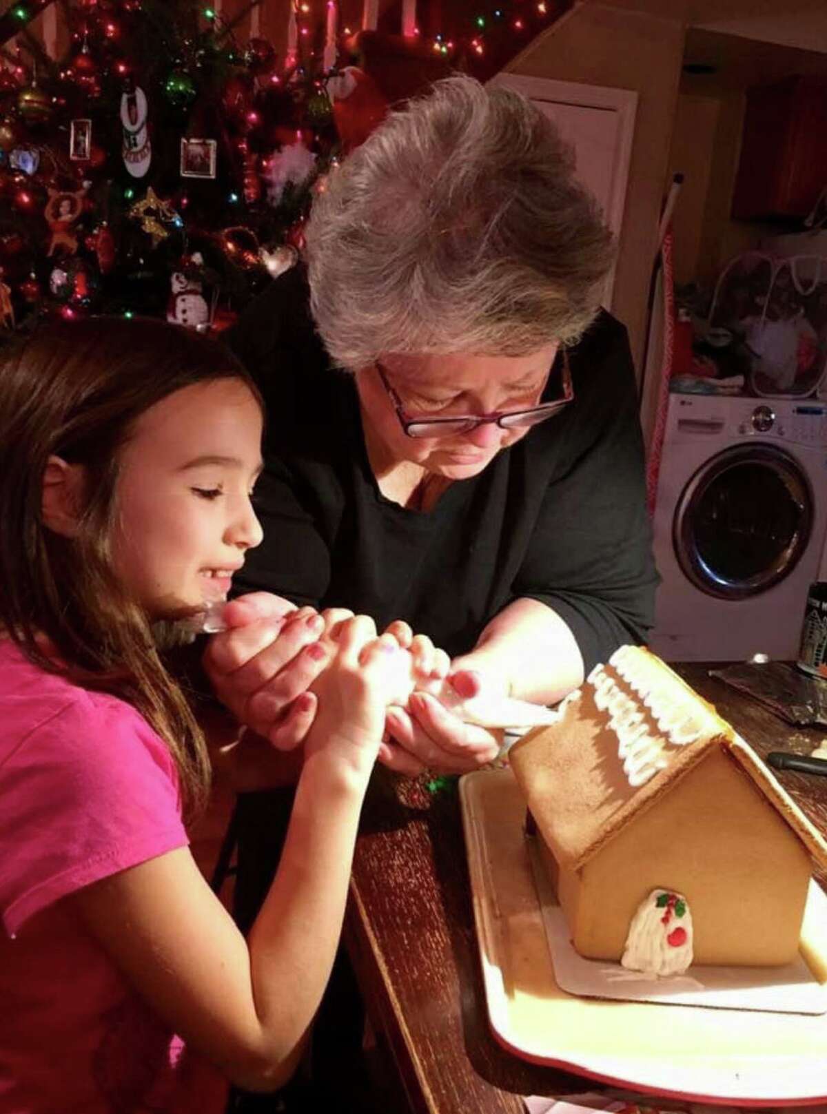 Jill Owens Zinzi teaches her granddaughter, Sofia, piping skills for icing a gingerbread roof. Sofia was 7 at the time. Zinzi, who started the Kent Gingerbread Festival, says Sofia is a third-generation gingerbread fan, along with her three grandsons. The Kent Gingerbread Festival, one of the largest in Connecticut, is in its 9th year and runs through December.