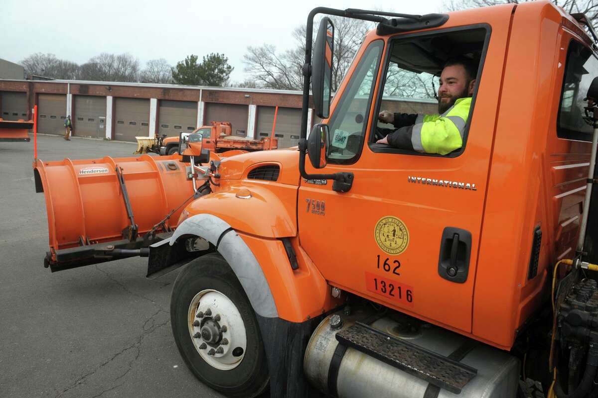 Mike Minishi parks his truck after having it filled with salt in preparation for the forecast snowstorm outside the Town of Fairfield’s department of public works garage, in Fairfield, Conn. Dec. 16, 2020.