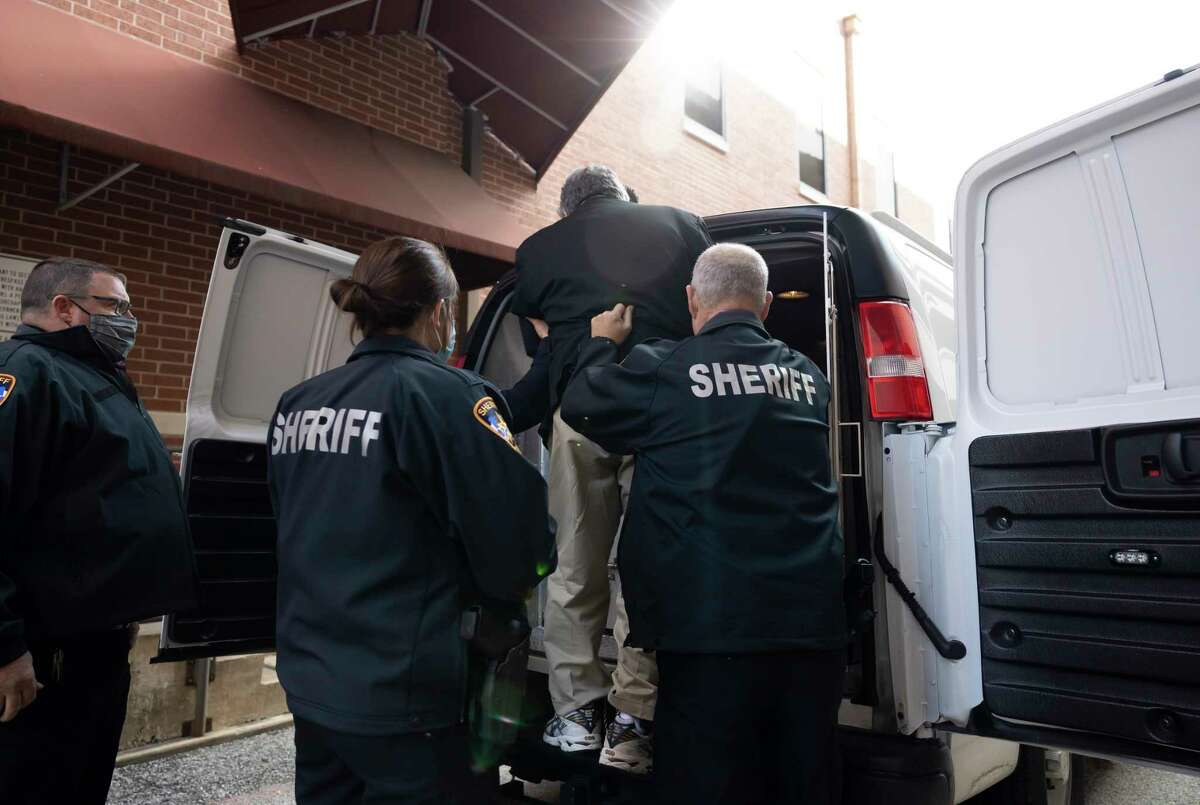 Manuel La Rosa-Lopez is escorting to the back of a Montgomery County transportation van after his sentencing in downtown Conroe, Wednesday, Dec. 16, 2020. La Rosa-Lopez pleaded guilty last month to several counts of indecency with a child accepting a 10 year sentence.