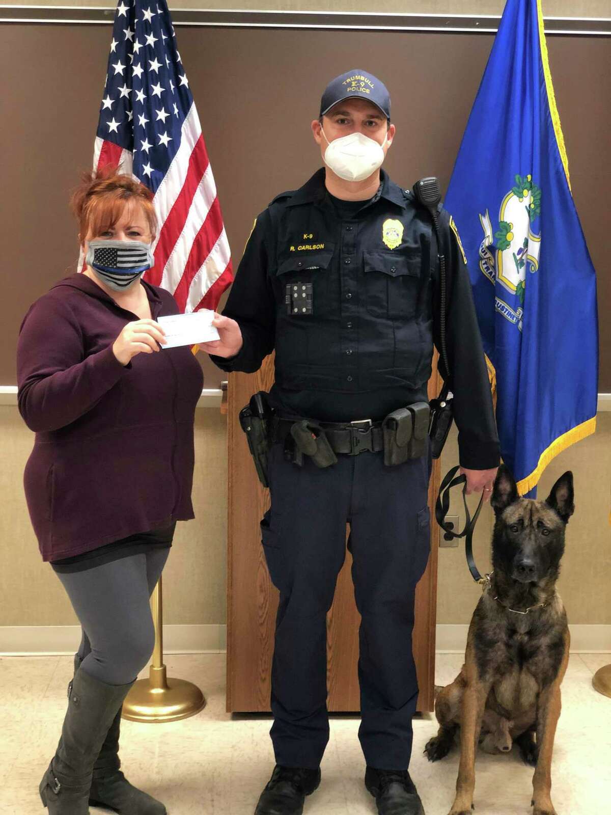 Cindy Penkoff, Trumbull K-9 Officer RJ Carlson, and K9 Rico