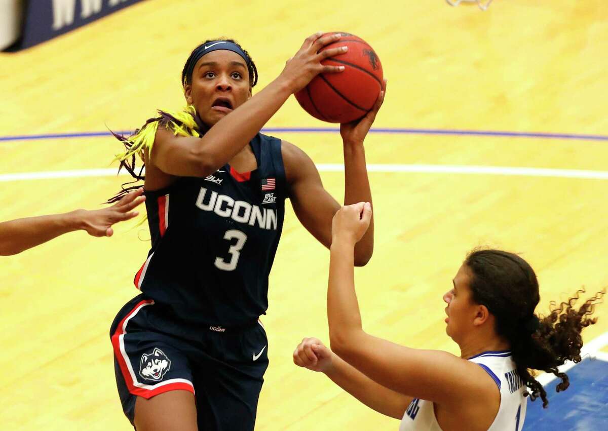UConn forward Aaliyah Edwards (3) drives to the basket against Seton Hall forward Skylar Treadwell during the second half of an NCAA basketball game on Tuesday, Dec.15, 2020, in South Orange, N.J. (AP Photo/Noah K. Murray)