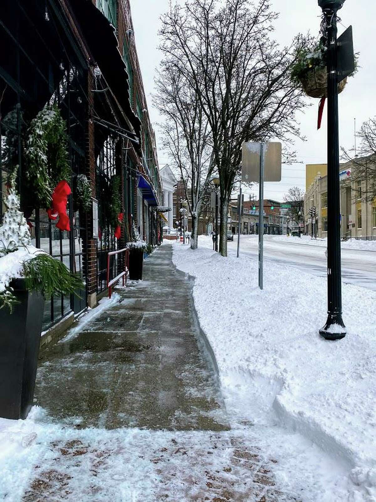 Snow lined North Main Street in Norwalk, Conn. on Dec. 17, 2020 after the area was hit with a storm that brought over 5 inches of snow.