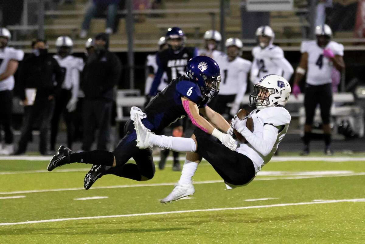 Montgomery cornerback Josiah Gaetani (6) tackles Fulshear wide receiver Parker Williams (9) during the first quarter of a District 10-5A (Div. II) football game at MISD Stadium in Montgomery.