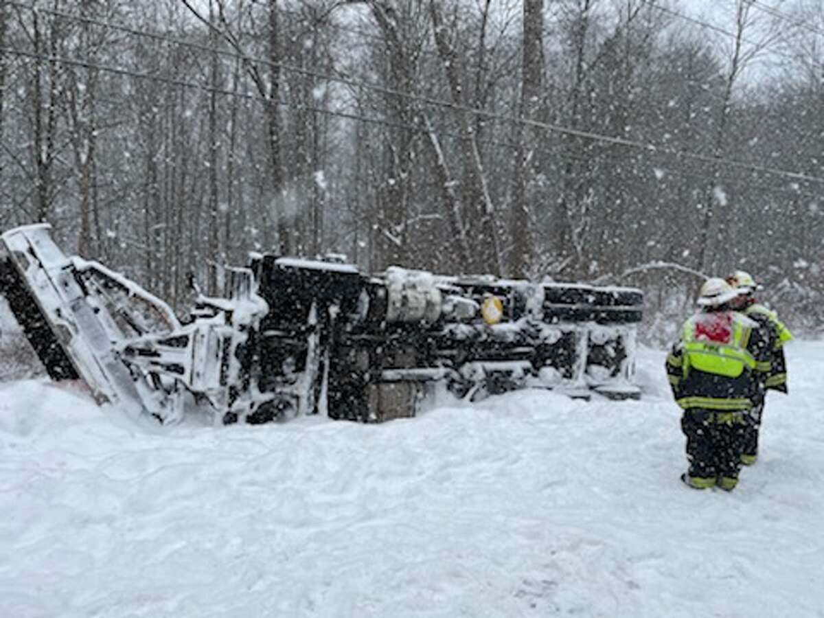 Snow plow overturned in Moreau ditch