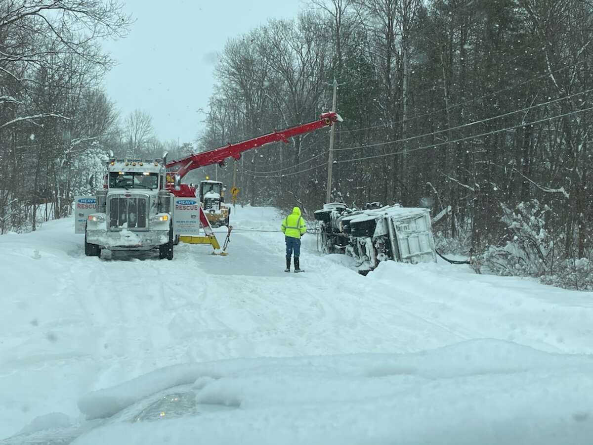 Snow plow overturned in Moreau ditch