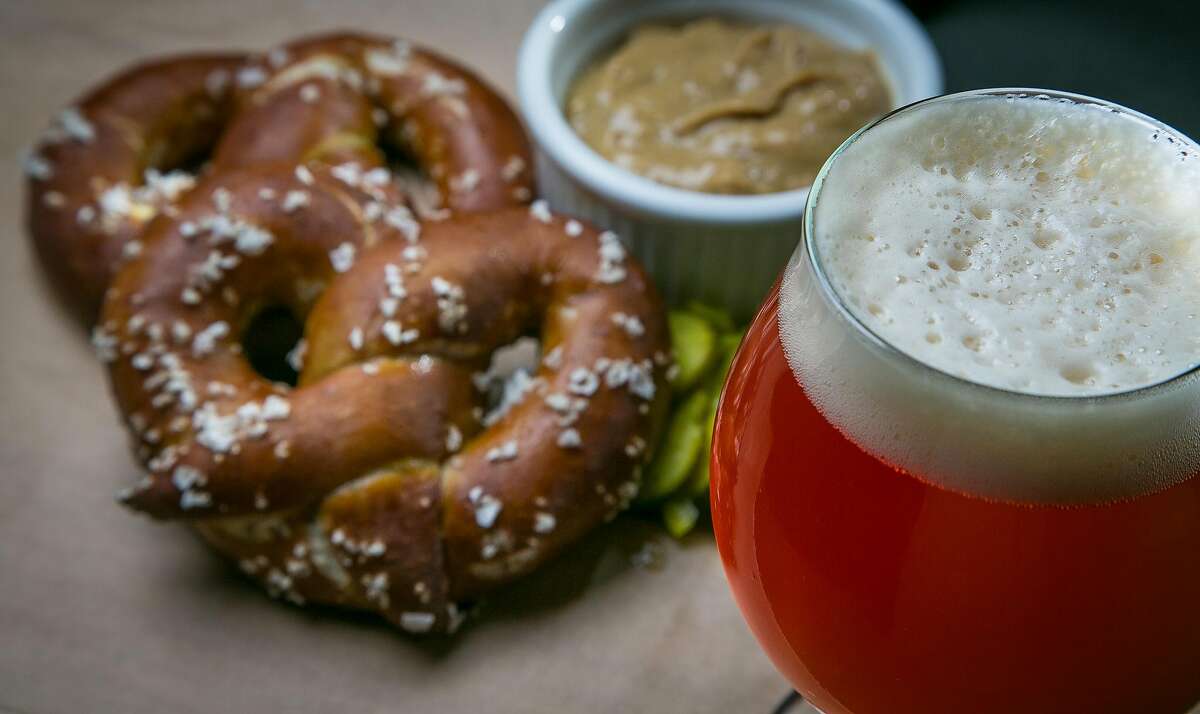 The Hangar 24 Hullabaloo beer with a pretzel at Steins Beer Garden in Mountain View.