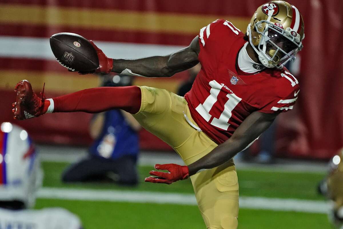 San Francisco 49ers wide receiver Brandon Aiyuk (11) look down the line  before the snap during an NFL football game against the Seattle Seahawks,  Sunday, Sept. 18, 2022, in Santa Clara, Calif. (