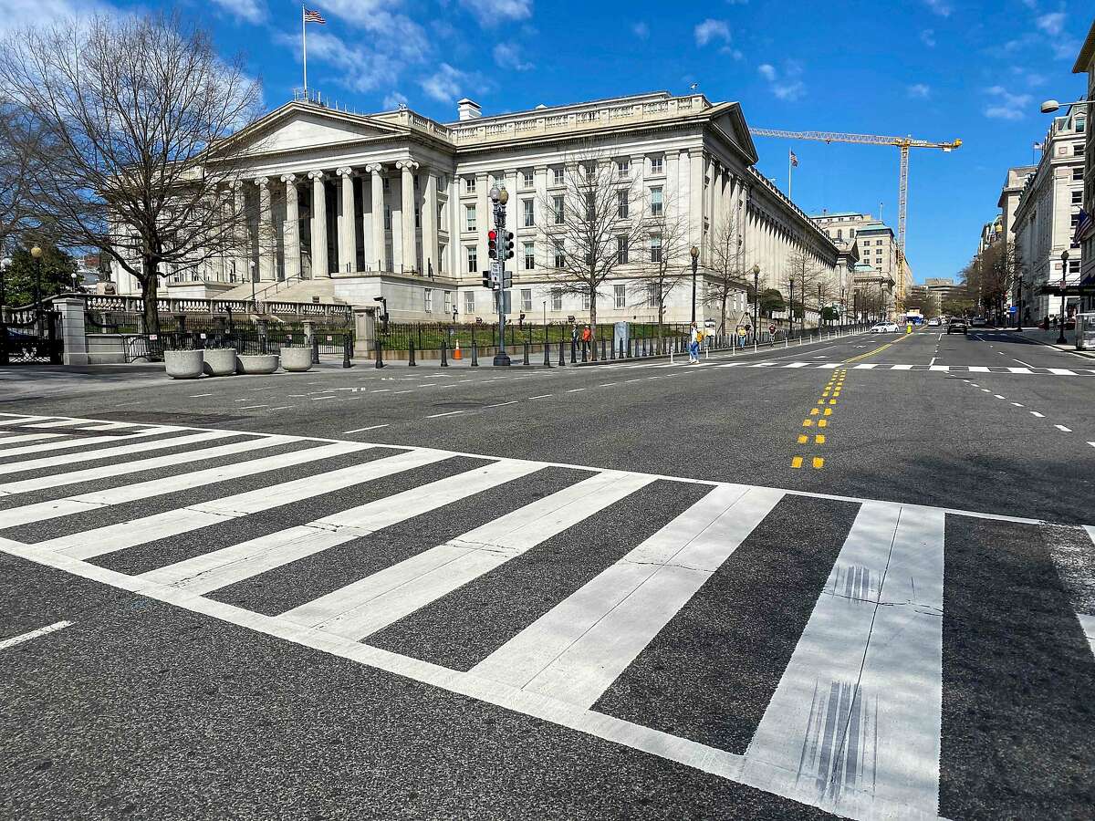 (FILES) In this file photo the US Treasury Department building is seen in Washington, DC on March 13, 2020. - The US government issued an emergency directive to federal agencies in the wake of a major cyberattack, as multiple media outlets reported at least two departments -- including the Treasury -- had been targeted by hackers with ties to Russia. In a statement on December 13, 2020, the Cybersecurity and Infrastructure Security Agency (CISA) said it had ordered federal agencies to immediately stop using SolarWinds Orion IT products following reports that hackers had used a recent update to gain access to internal communications. (Photo by Eric BARADAT / AFP) (Photo by ERIC BARADAT/AFP via Getty Images)