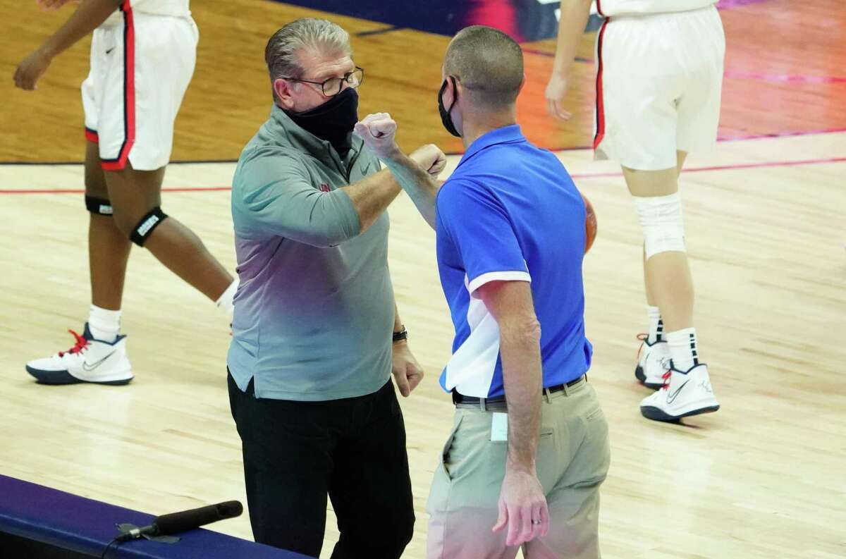 Dec 17, 2020; Storrs, Connecticut, USA; UConn Huskies head coach Geno Auriemma and Creighton Bluejays head coach Jim Flanery meet after the game at Harry A. Gampel Pavilion. UConn defeated Creighton 80-47. Mandatory Credit: David Butler II-USA TODAY Sports