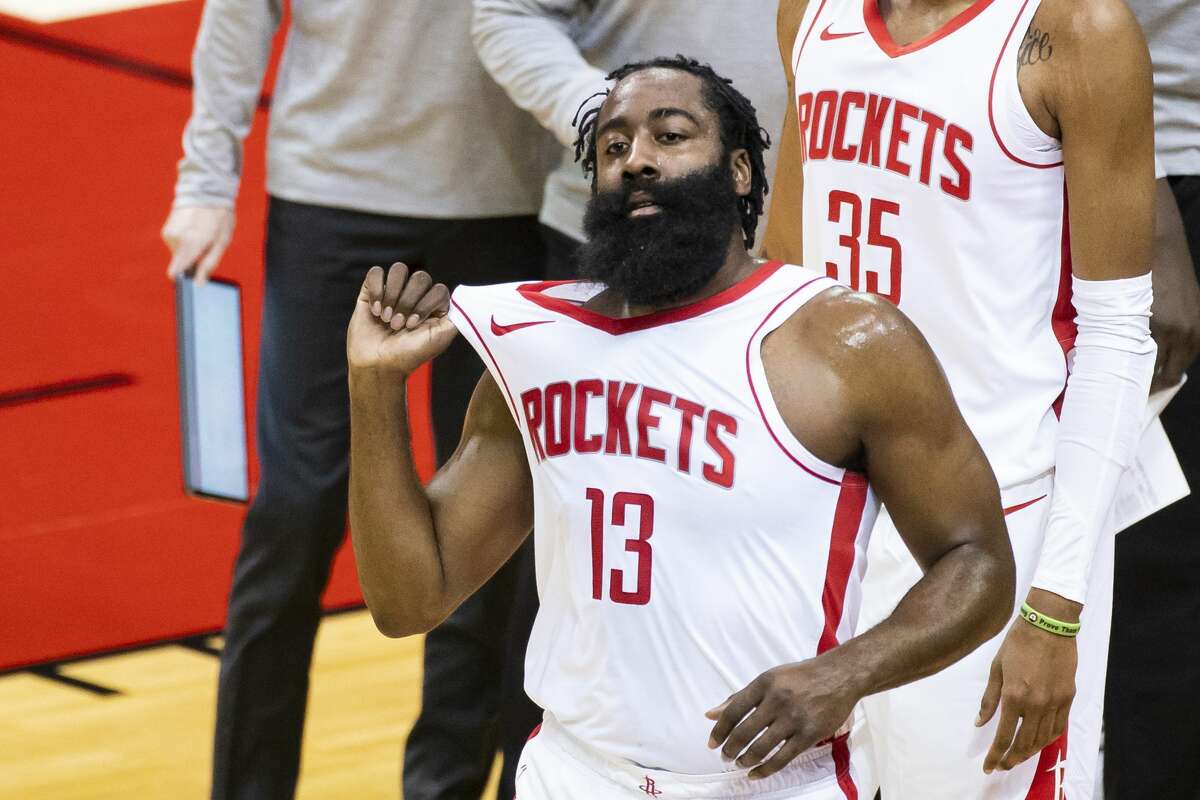 Houston Rockets guard James Harden (13) walks back to the court after a timeout during the first quarter of a preseason NBA basketball game between the Houston Rockets and the San Antonio Spurs on Thursday, Dec. 17, 2020, at Toyota Center in Houston.