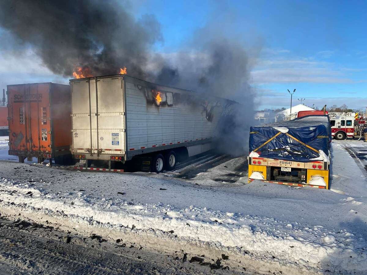 Four tractor trailers were damaged and one firefighter was taken to the hospital Thursday, Dec. 17, 2020 after a fire at a truck stop in Milford, Conn. near I-95.