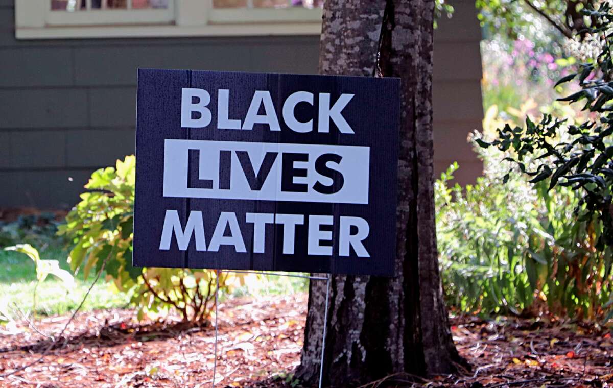 Black Lives Matter yard sign in residential neighborhood. (Photo by: Photographer Don & Melinda Crawford/Education Images/Universal Images Group via Getty Images)
