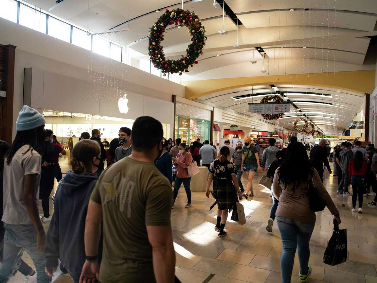 Holiday shoppers make their way through North Park Mall. The National Retail Federation forecasts sales will rise between 3.6 and 5.2 percent in November and December, totaling as much as $766.7 billion.