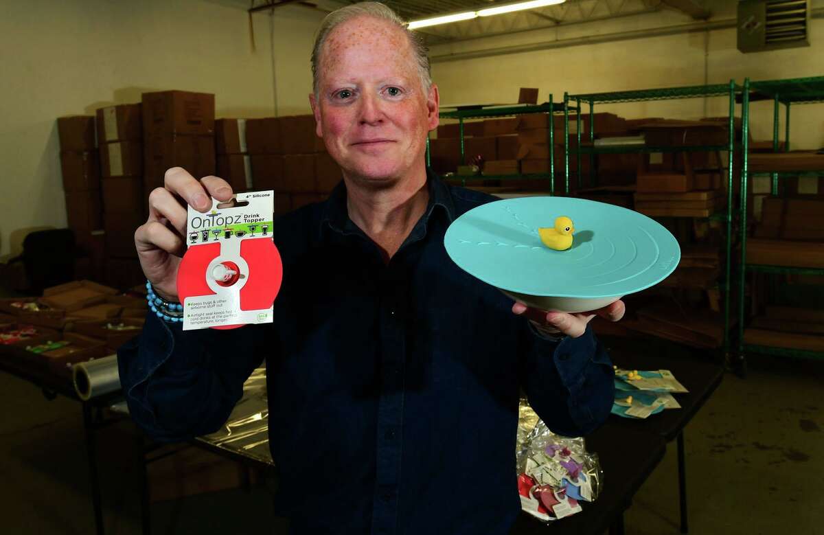 Norwalk resident David Farnworth, CEO and founder of OnTopz, at their facility Wednesday, December 16, 2020, in Norwalk, Conn. OnTopz manufactures round silicone lids that seal the the tops of open beverage glasses and food containers topped by whimsical characters.