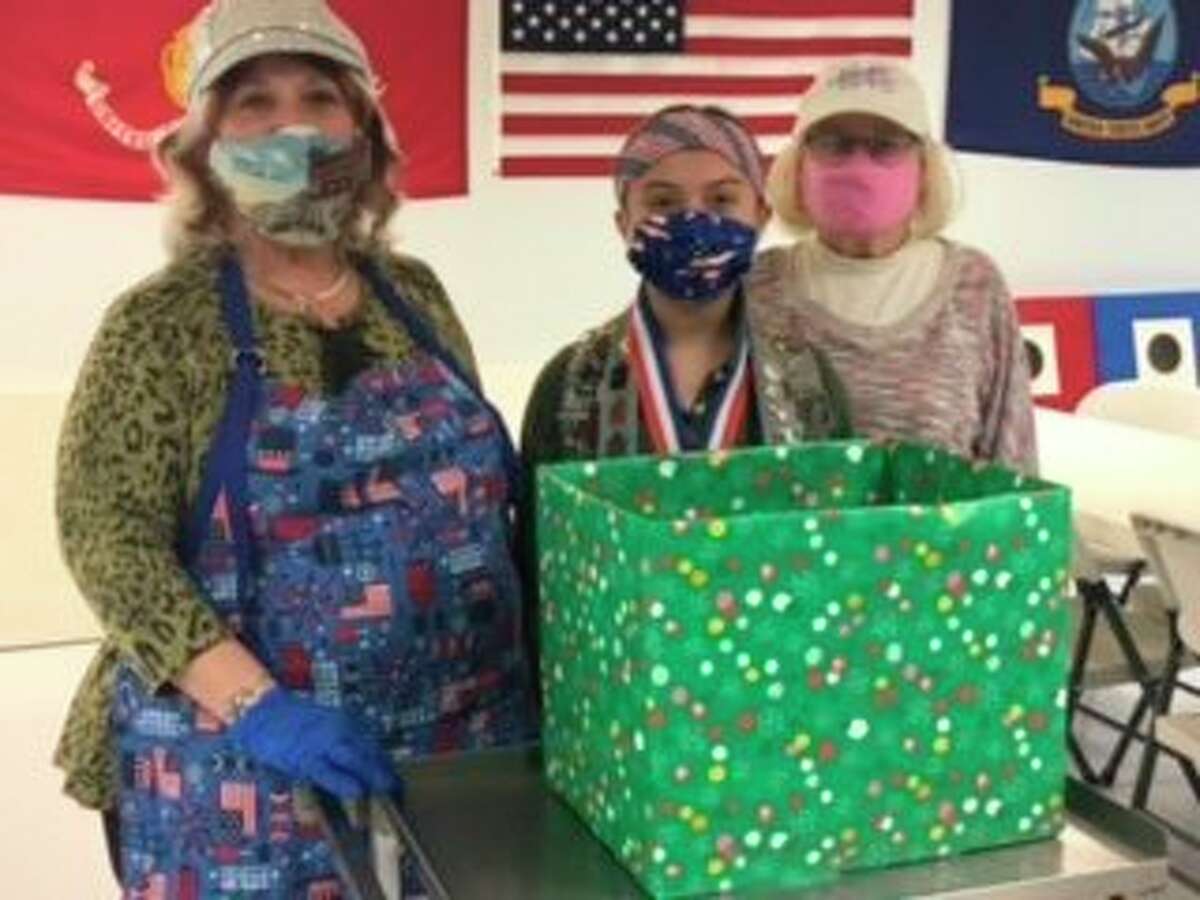 The American Legion Auxiliary Post #10 and the Sons of the Legion donated candy for Miss Sawyer's Kids with a Cause Christmas stocking cause for active military. Pictured (left to right) are auxiliary president Pati Potes, Sawyer Hendrickson and auxiliary chaplain Kathy Yoder. (Courtesy photo)