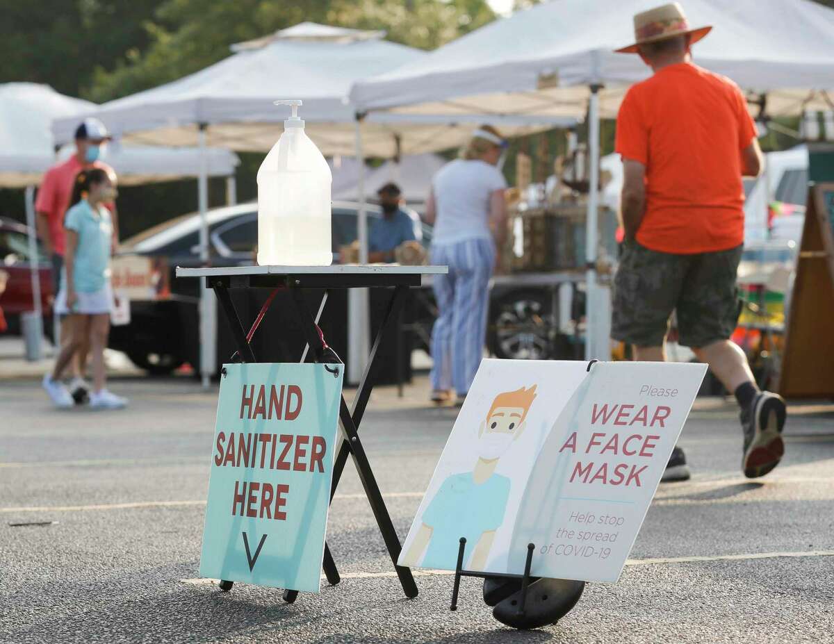 Bruce Cunningham, a member of the Grogan’s Mill Village Association board and one of the co-founders of the market, said after officials surveyed vendors and analyzed data from the 2020 year, they felt it best to open an hour later and also allow vendors that fall under the “Cottage Law” classification. There will also be a new CBD product vendor, a first for the market since Texas loosened cannabidiol regulations. Hand sanitizer and a sign reminding visitors to wear face masks are seen during The Woodlands Farmers Market, Saturday, Sept. 19, 2020, in The Woodlands.