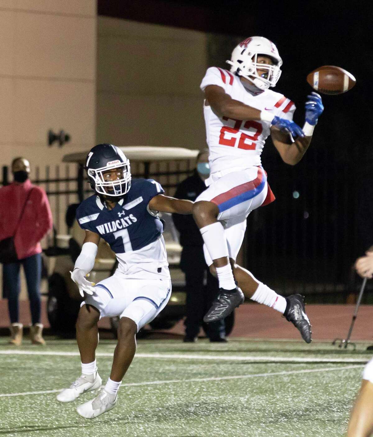 Oak Ridge strong safety Jordan Holmes (22) attempts to intercept a pass to Tomball Memorial wide receiver Chase Lovick (7) during the first quarter of a Region II-6A area playoff game at Tomball ISD Stadium, Friday, Dec. 18, 2020, in Tomball.