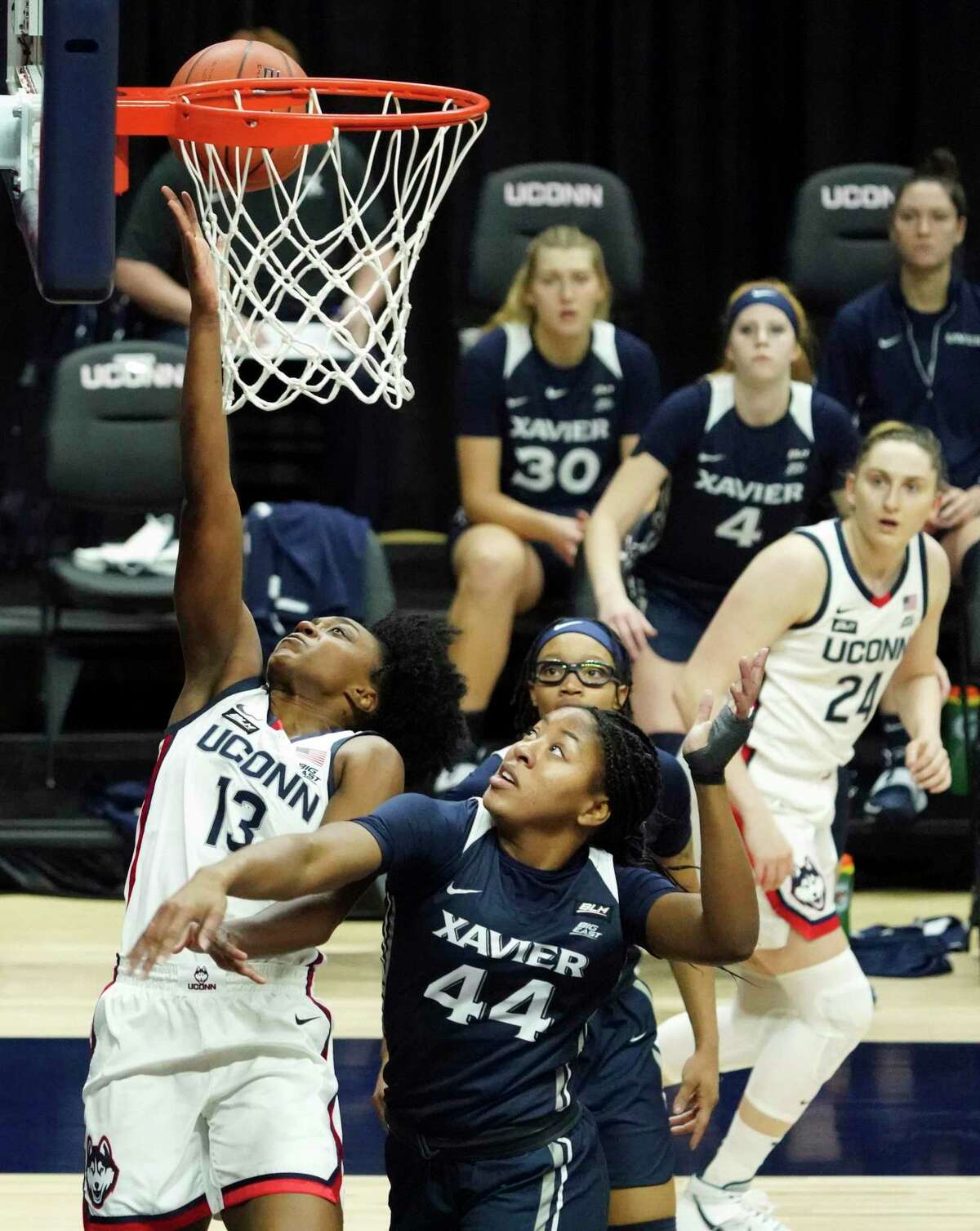 UConn guard Christyn Williams (13) shoots and is fouled by Xavier forward Ayanna Townsend (44) in Saturday’s game in Storrs. Williams led all scorers with 24 points on 8-for-11 shooting and was 4 for 5 from 3-point range.