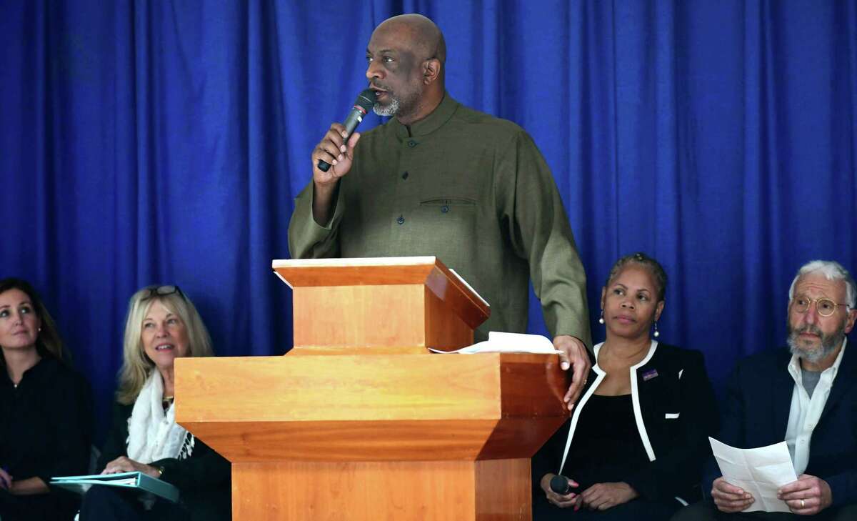 The Reverend Anthony Bennett of Mt. Aery Baptist Church in Bridgeport and Co-Chair of CONECT welcomes guests as the candidates for Norwalk's Board of Education debate a number of topics, including racial disparity in the district, Tuesday, October 29, 2019, at Grace Baptist Church in Norwalk, Conn. The debate was hosted by CONECT (Congregations Organized for a New Connecticut).