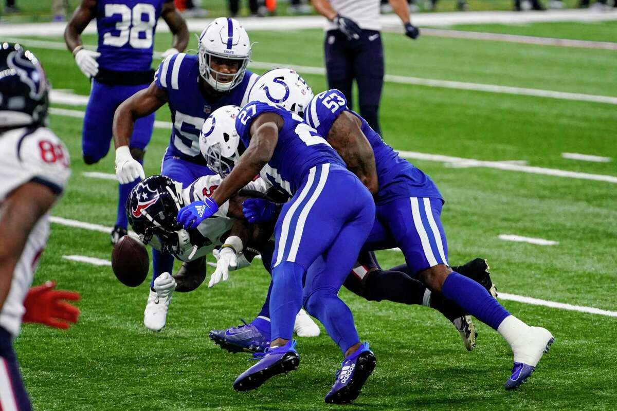 Houston Texans wide receiver Keke Coutee (16) fumbles the ball as he runs in the final minute of the second half against the Indianapolis Colts of an NFL football game in Indianapolis, Sunday, Dec. 20, 2020. (AP Photo/AJ Mast)