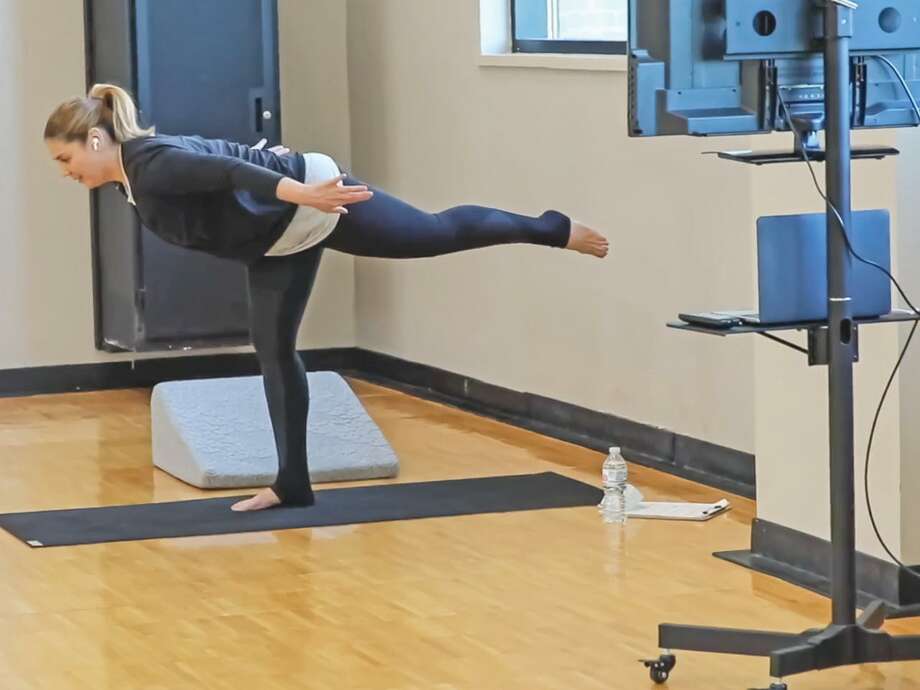In this video still, Dr. Bernice Sánchez demonstrates a yoga posture for her virtual audience. Photo: Courtesy /TAMIU